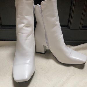 Women’s white ankle boots.